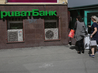 People enter the branch of Privat Bank in Kyiv, Ukraine, April 26, 2019. Kyiv District Administrative Court ruled that the nationalization o...