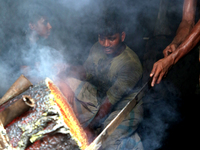Liquid iron is flowing into the prepared propeller mould at a dockyard on the bank of River Buriganga in Dhaka, Bangladesh (