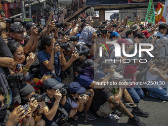 Photographers and cameramen cover protesters taking part in Labor Day demonstrations outside the presidential palace on May 1, 2019 in Manil...