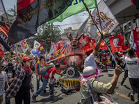 Protesters take part in Labor Day demonstrations outside the presidential palace on May 1, 2019 in Manila, Philippines. Thousands of Filipin...