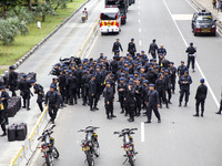 Jakarta, 01 May 2019 : Mobile Brigade Police Squad during the demonstration on guard. Thousands of Labor filled Merdeka Barat Street Jakarta...