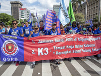 Jakarta, 01 May 2019 :Labors with the banner demanding for more wages ofr labor during the demonstration.  Thousands of Labor filled Merdeka...