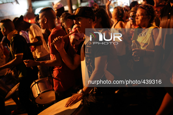 A man plays drums on a Carnival parade in Augusta Street in Sao Paulo, Brazil on February 13, 2015. It is estimated that millions of people...