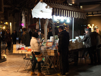 Street pictures from Athens within February 2015.
Open air book store in Athens at night.
(