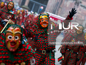 Participants with masks and colorful costumes during the traditional Rose Monday carnival parade on February 16, 2015 in Freiburg Germany....