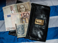 50 Deutsch-Mark, 50 Euro, 50 Drachmas and a shadow(