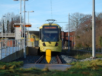 A Metrolink tram awaiting departure at East Didsbury station on Monday 5th January 2015. -- The Manchester Metrolink is a light-railway tran...