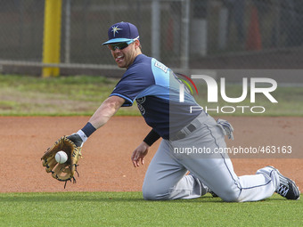 Tampa Bay Rays infielder Jake Elmore (83) takes fielding practice on his knees Saturday, February 28, 2015 at Charlotte Sports Park in Port...