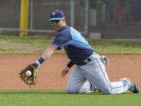 Tampa Bay Rays infielder Jake Elmore (83) takes fielding practice on his knees Saturday, February 28, 2015 at Charlotte Sports Park in Port...