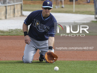 Tampa Bay Rays third baseman Evan Longoria (3) takes fielding practice on his knees  Saturday, February 28, 2015 at Charlotte Sports Park in...