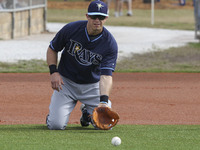 Tampa Bay Rays third baseman Evan Longoria (3) takes fielding practice on his knees  Saturday, February 28, 2015 at Charlotte Sports Park in...
