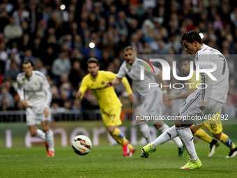 Real Madrid's Portuguese forward Cristiano Ronaldo scores a goal during the Spanish League 2014/15 match between Real Madrid and Villarreal...