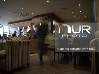 A person walking through a Costa Coffee shop in Stockport on Monday 2nd March 2015. (