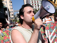 An activist speaks in a megaphone during a rally in favor of the creation of the 'Augusta Park' after being expelled by police from the area...