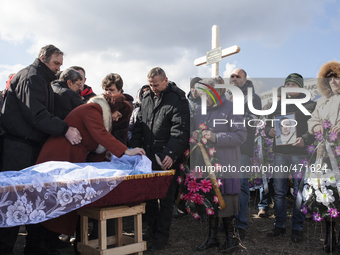 Funerals of a coal miners who was killed in a mine collapse at Zasyadtko mine, is laid in rest during his funeral, on March 6, 2015 in Donet...