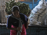 Female freight workers serve customers in Beringharjo traditional market, Special Region of Yogyakarta province, on Monday, August 5, 2019....
