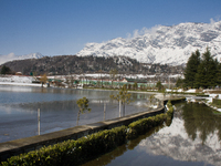 SRINAGAR, KASHMIR, INDIA - MARCH 10: Snow capped Zabarvan mountains are reflected in a pond on March 10, 2015 in Srinagar, the summer capita...
