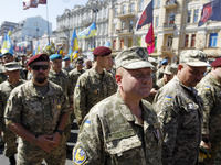 Ukrainian servicemen, veterans of the Eastern Ukrainian conflict with Russia-backed separatists, march during a many-thousand unofficial mil...