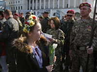Pupils bring a flowers and pictures for soldiers. Ukraine marks the first anniversary of the first volunteering General Kulchycky battalion...
