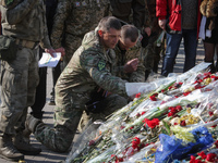 National guard soldiers walk up the Instytutska street to lay flowers near the Memorial of Hevenly Hundreed. Ukraine marks the first anniver...