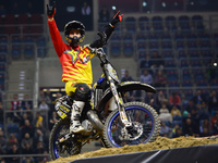 Rob Adelberg, an Australian FMX rider, celebrates after his final jump in the opening day of Diverse NIGHT of the JUMPs in Krakow's Arena. K...