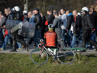 Cracovia's supporters are excorted by rieinforced security forces ahead of the derby match between Wisla Krakow and Cracovia Krakow, a Polis...
