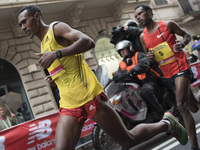 Runners take part of the 21th Marathon of Rome under heavy rain on March 22, 2015. (