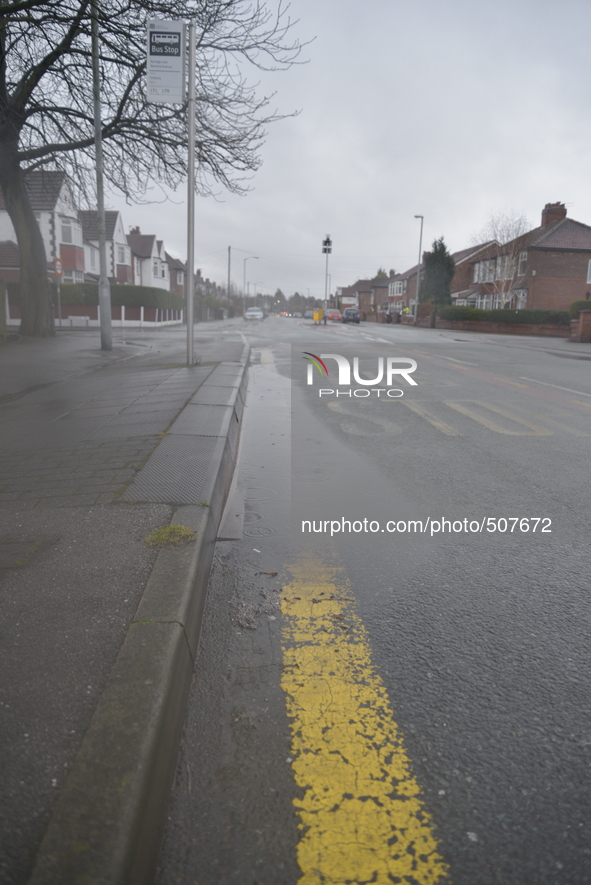 A puddle forming on a road in Stockport, on Monday 30th March 2015. 
