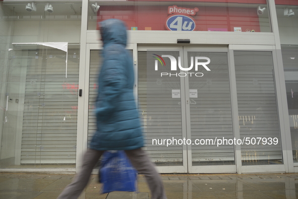 Light shining on a closed retail unit on Monday 30th March 2015. 