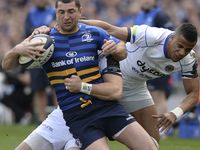 Leinster's Rob Kearney tackled by Bath's Horacio Agulla (Left) and Anthony Watson (Right) during European Champions Cup Quarter-Final meetin...