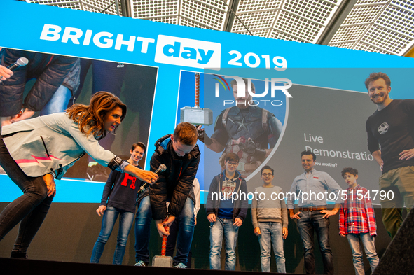 Some kids trying to move the Thor's hammer during a live demonstration with James Hobson, aka The Hacksmith, at the Bright Day Festival in A...