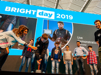 Some kids trying to move the Thor's hammer during a live demonstration with James Hobson, aka The Hacksmith, at the Bright Day Festival in A...