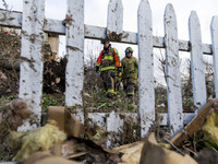 Emergency response crew examines the carnage left by a tornado passing by the evening before at the town of Fairdale, Illinois on Apr 10, 20...