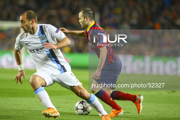Andres Iniesta (r) in the match between FC Barcelona and Manchester City, for the second leg of the round of 16 of the Champions League matc...