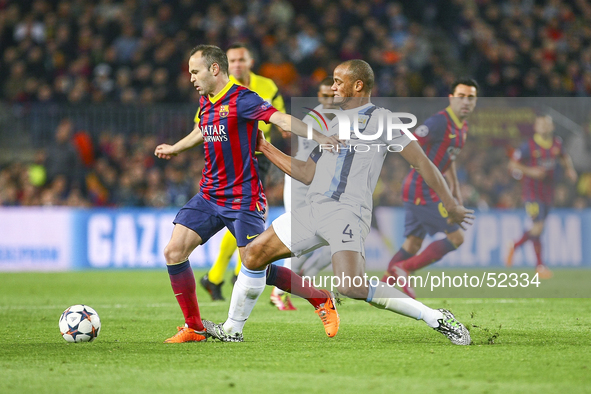 Andres Iniesta (l) in the match between FC Barcelona and Manchester City, for the second leg of the round of 16 of the Champions League matc...