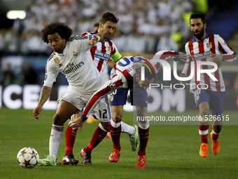 SPAIN, Madrid:Atletico de Madrid's Spanish Defender Juanfran Torres and Real Madrid's Brazilian Defender Marcelo during the Champions League...