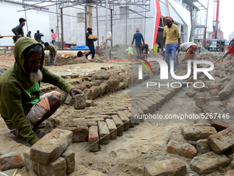 Bangladeshi day labor works at the construction site of Dhaka international Trade Fair in Dhaka, Bangladesh, on December 26, 2019. (