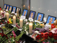 Flowers and candles are seen at a makeshift memorial for the crew members of the Ukrainian Boeing 737-800 plane that crashed in Iran, at the...