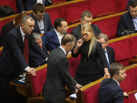 Batkivshchyna party leader Yulia Tymoshenko (C) ttends lawmakers work at the session of the Verkhovna Rada in Kyiv, Ukraine, January 14, 202...