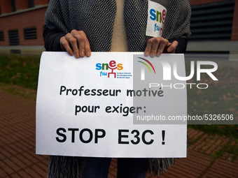 The paper reads 'Teacher eager to demand : stop E3C!'. High school teachers gathered in front of the Board of Education of Haute Garonne. Th...