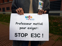 The paper reads 'Teacher eager to demand : stop E3C!'. High school teachers gathered in front of the Board of Education of Haute Garonne. Th...