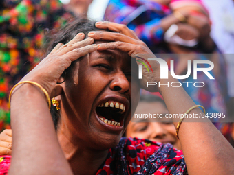A Bangladeshi relative of a victim of the Rana Plaza building collapse weeps as she marks the second anniversary of the disaster at the site...