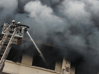 Firemen try to extinguish a fire that broke out at GST Bhavan in Mumbai's Mazgaon area on 17 February 2020. There have been no casualties re...