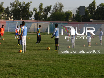 AFGHANISTAN, KANDAHAR; A group youngs guys are busy in Football traning. In Kandahar, Trainer Show the regulation or the way of football in...