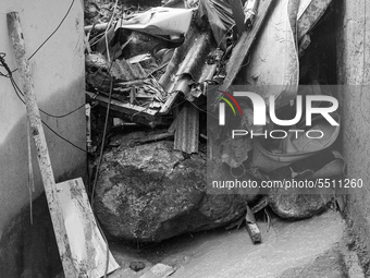 (EDITOR'S NOTE: Image was converted to black and white) Collapse during the last dawn left at least three fatal victims at Morro do Macaco M...