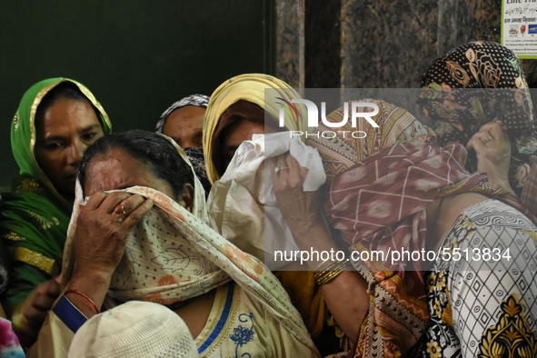 Family members of Bhure Ali wail during his funeral in Mustafabad area of east Delhi, India on 04 March 2020. Ali, a labourer left home on 2...