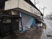 A destroyed dry cleaners along the main street in Futaba, Fukushima prefecture at 10 March 2020.
 (