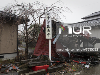 A signboard of the temple with a destroyed entrance in Futaba, Fukushima prefecture at 10 March 2020. (