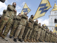 Ukrainian veterans of the 'Azov' volunteer battalion attend a rally dedicated to the Volunteer Day in honor of volonteer fighters who joined...
