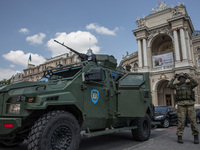 Armored car Ukrainian KrAZ production with the soldiers of the Security Service of Ukraine on the background of the opera house. In the days...